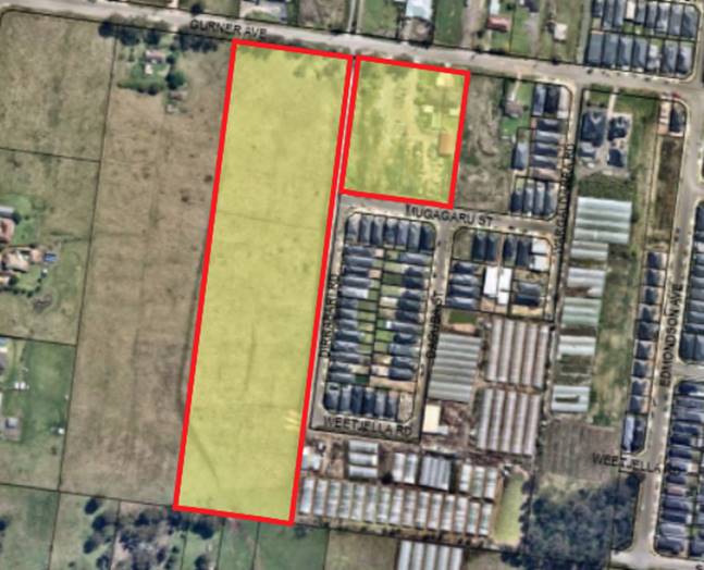 An aerial view of a farm land

Description automatically generated