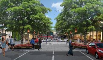 A street with people walking on it

Description automatically generated