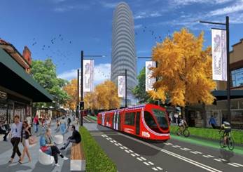 A red train on a street

Description automatically generated