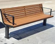 A bench on the sidewalk

Description automatically generated
