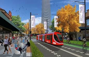A red train on a street

Description automatically generated