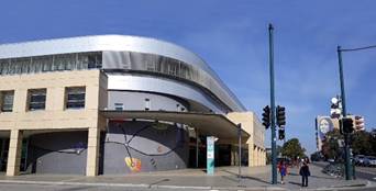 A building with a curved roof

Description automatically generated